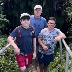 family of dad and two young boys