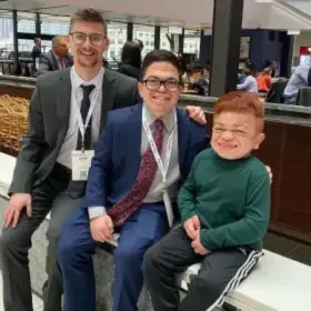 Man and boy sitting together